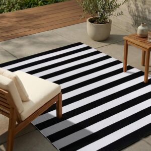 UV-resistant black and white striped outdoor rug, black and white outdoor rug, striped patio rug, UV resistant outdoor carpet, weatherproof outdoor rug, waterproof patio rug, farmhouse outdoor rug, porch area rug, outdoor floor mat, deck rug, fade resistant outdoor rug, patio decor rug, outdoor living rug, washable outdoor rug, durable outdoor carpet, modern outdoor rug, outdoor seating area rug, striped outdoor carpet, front porch rug, patio area rug